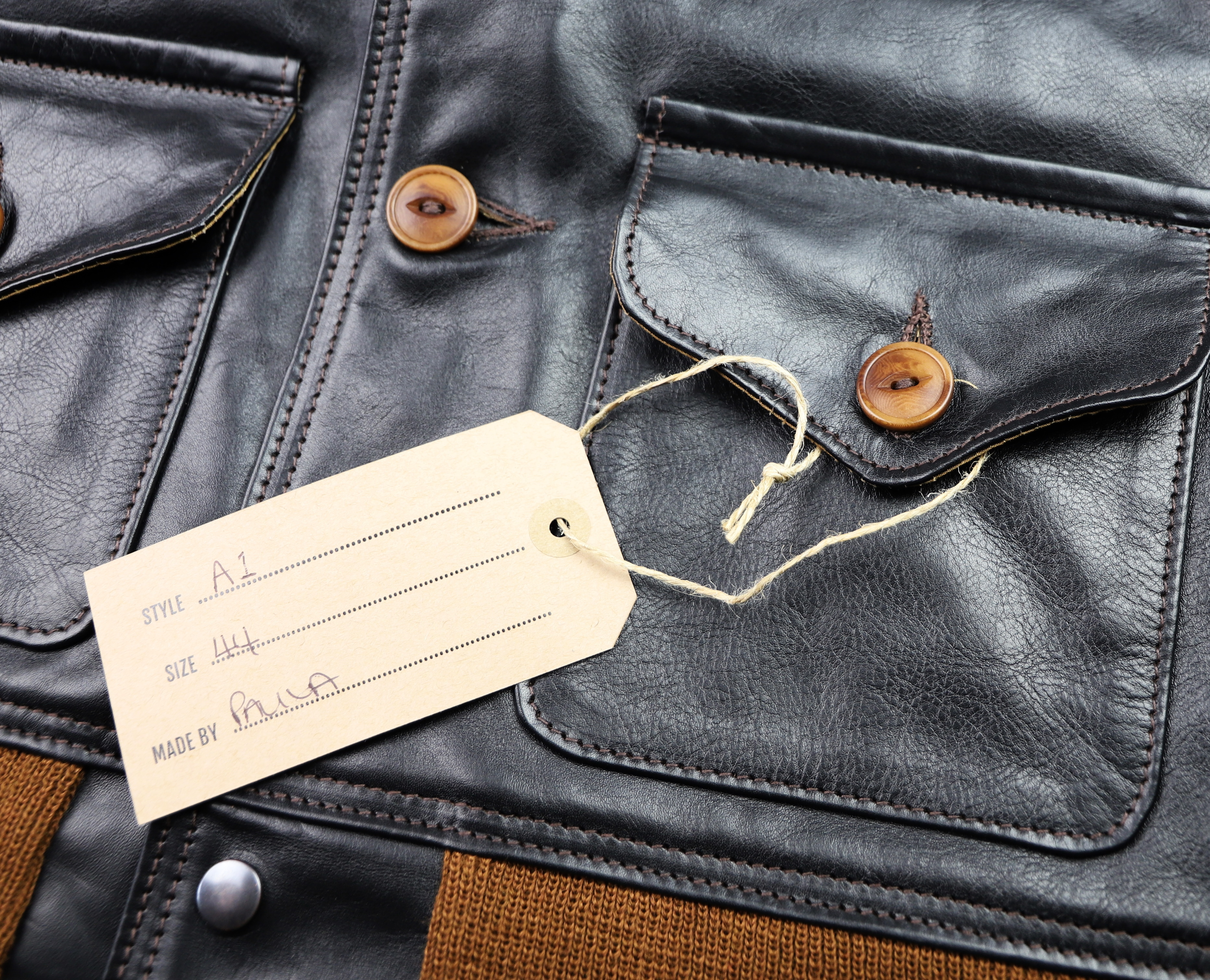 Aero A-1 Blackened Brown Vicenza Horsehide EMW name tag.jpg