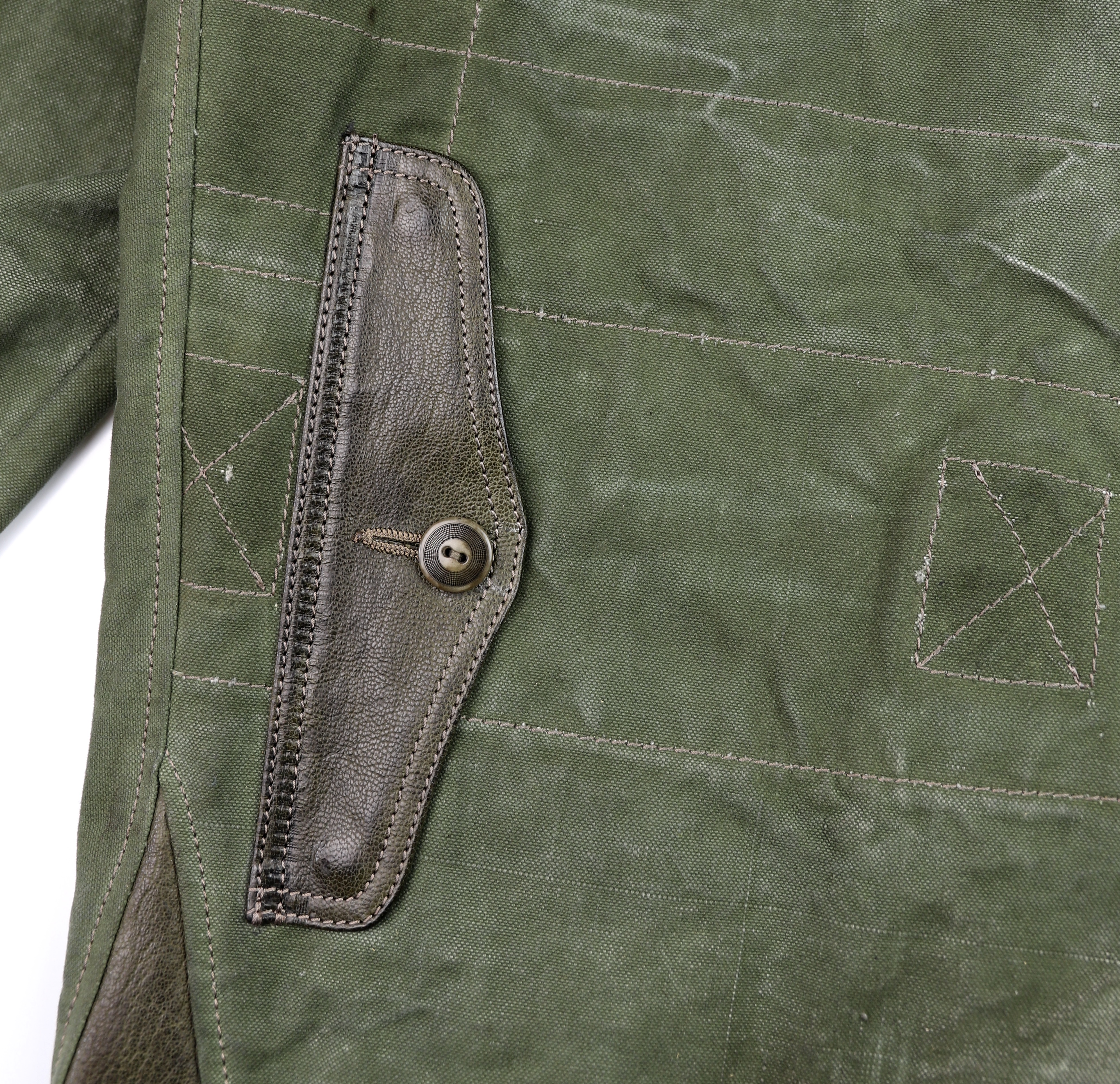 Thedi Canvas and Green Goatskin Button-Up map pocket.jpg