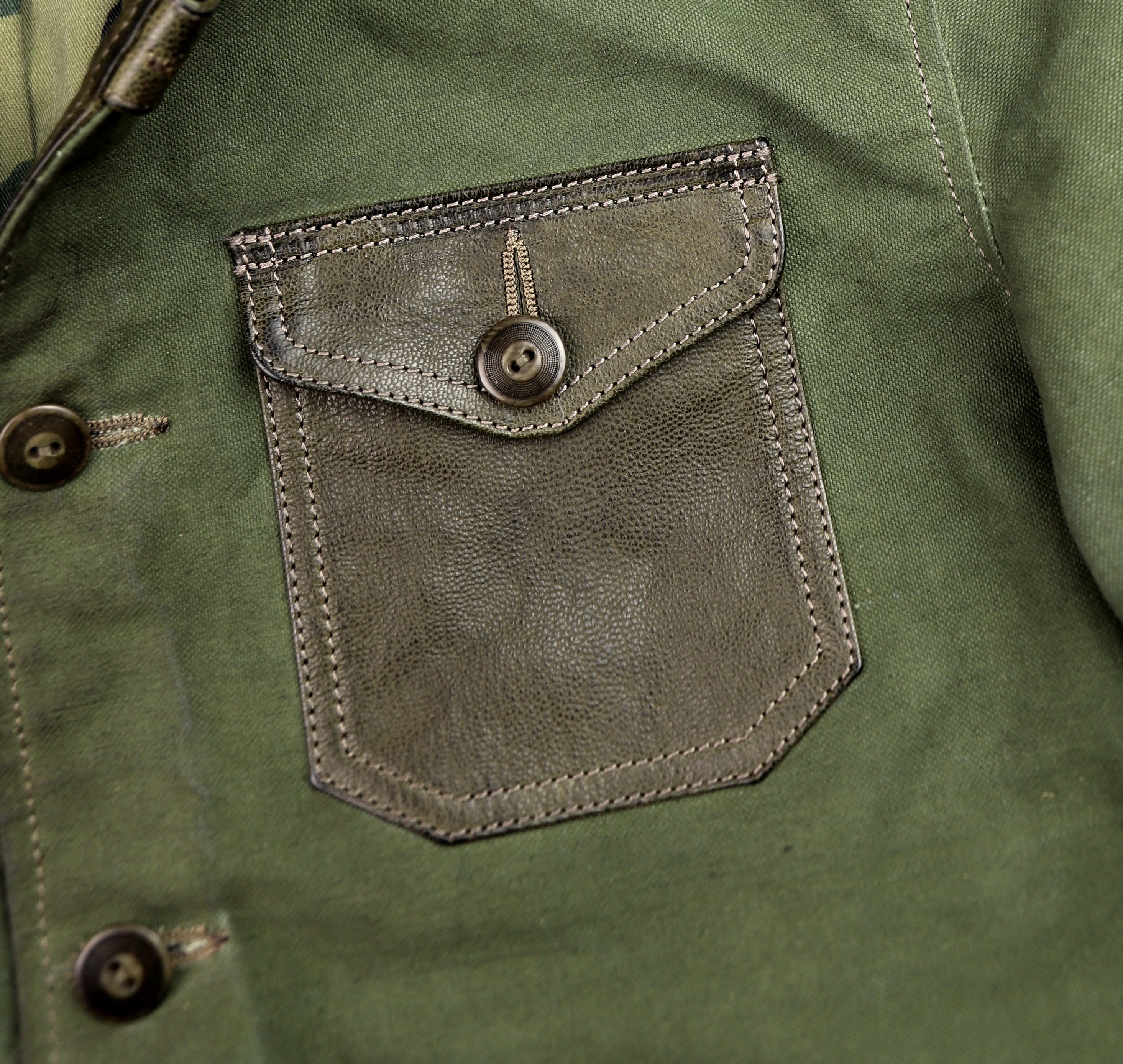 Thedi Canvas and Green Goatskin Button-Up patch pocket.jpg