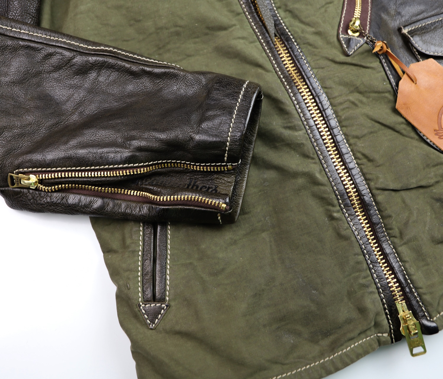 Thedi Canvas and Olive Goatskin Crosszip zip sleeve.jpg