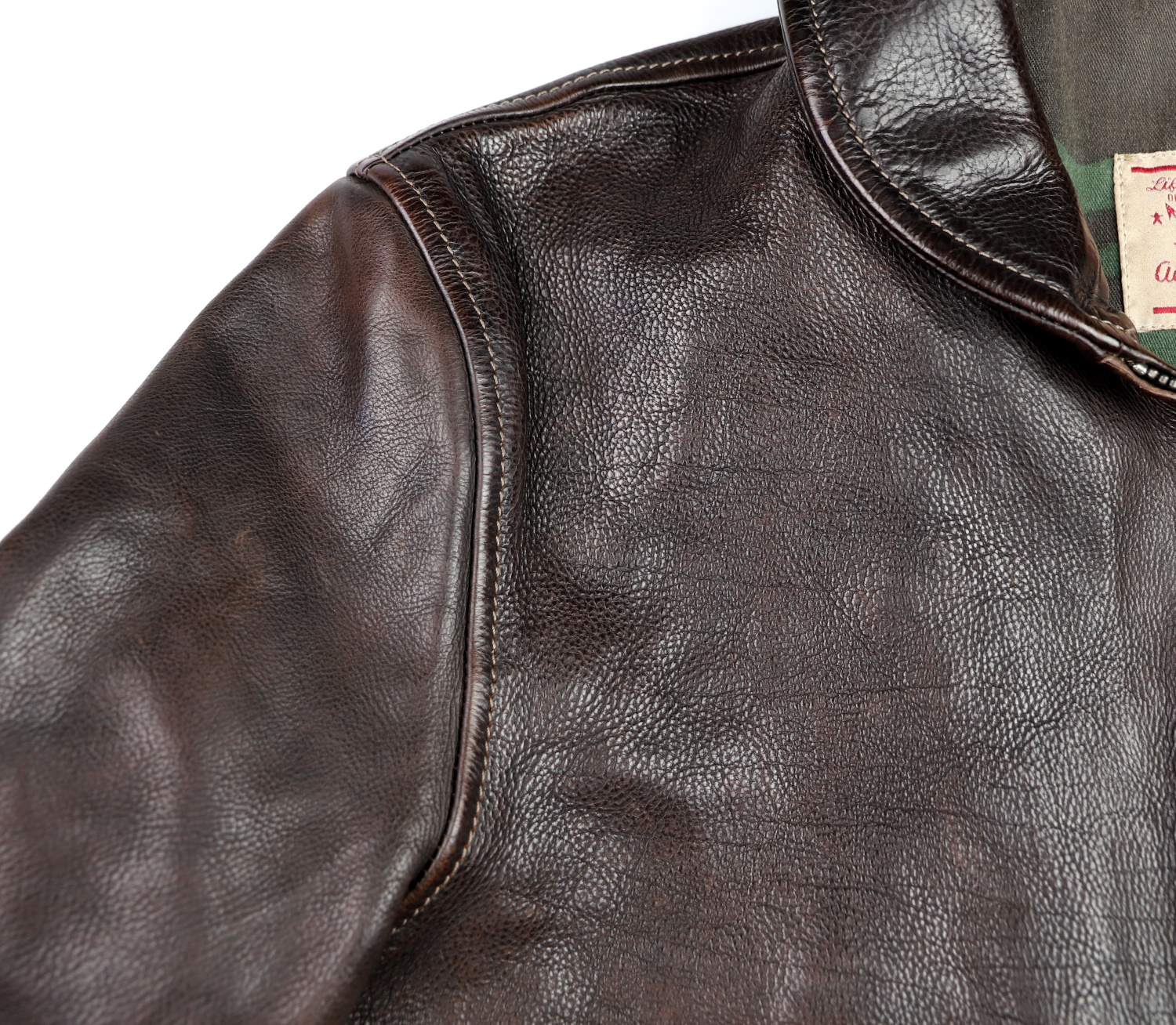 Thedi Markos Zip-Up Shawl Collar Brown Canneto Cowhide XL1 shoulder grain.jpg