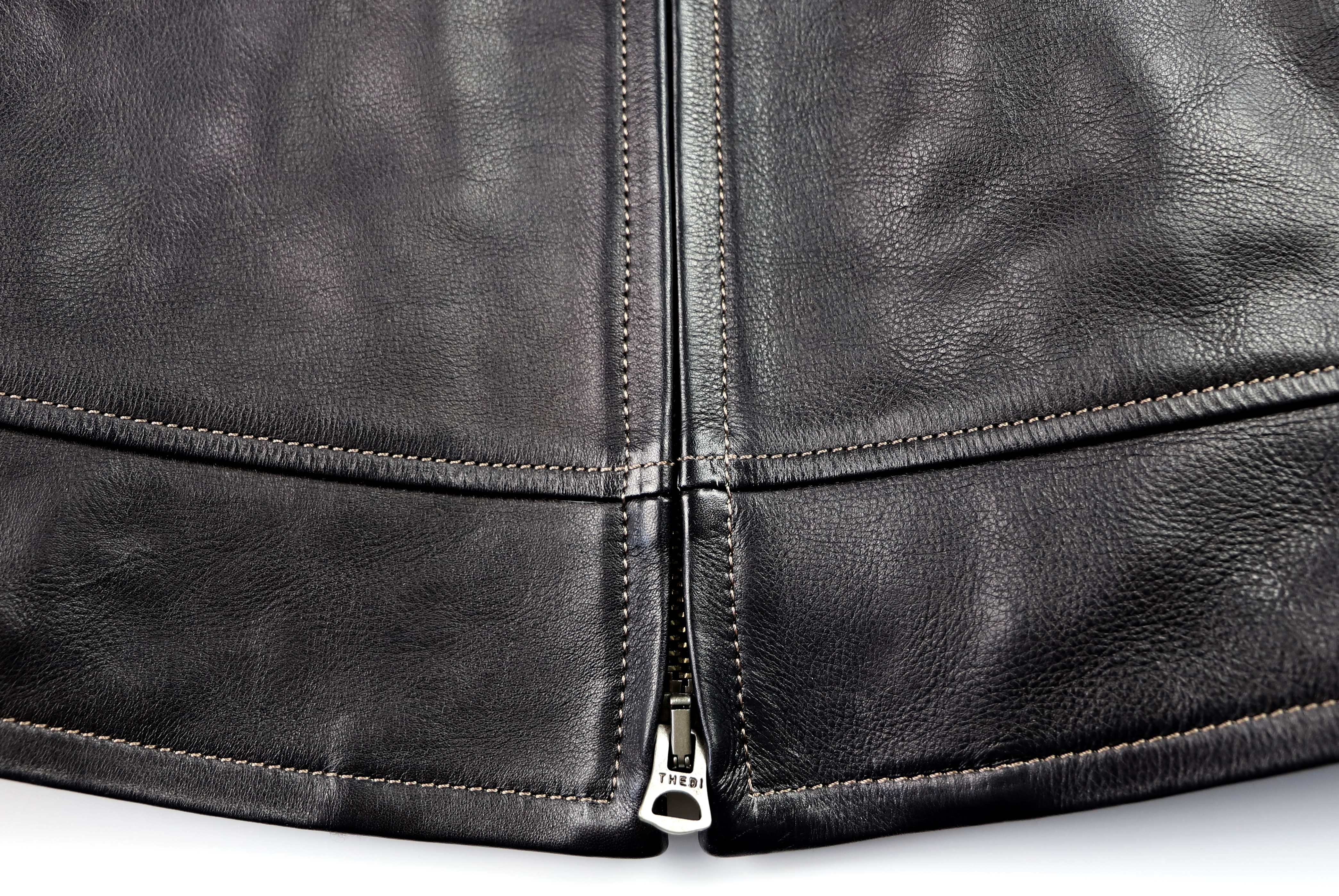 Thedi Zip-Up Shawl Collar Black Cowhide bottom hem.jpg